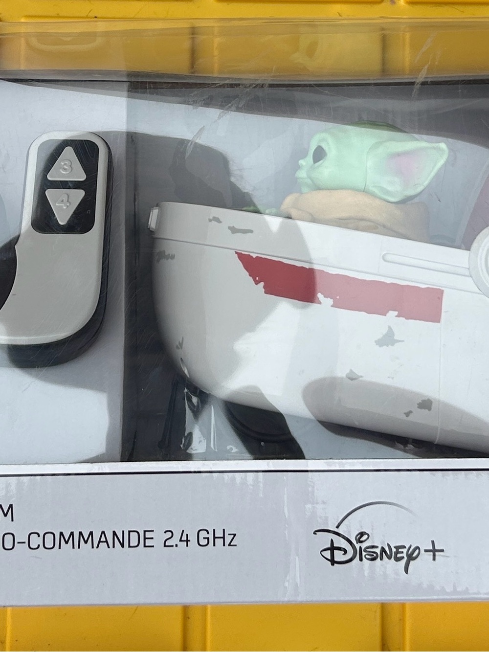 Disney Grogu Figure in White Pod with Green Head and Red Accent
